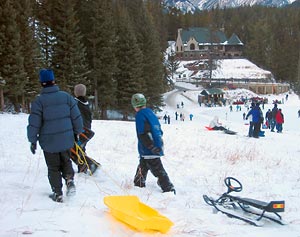 Sledding behind Fairmont Banff Springs in the Canadian Rockies.