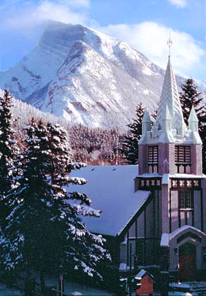 St. Paul's Church in Banff with a snow-capped Mt. Rundle.